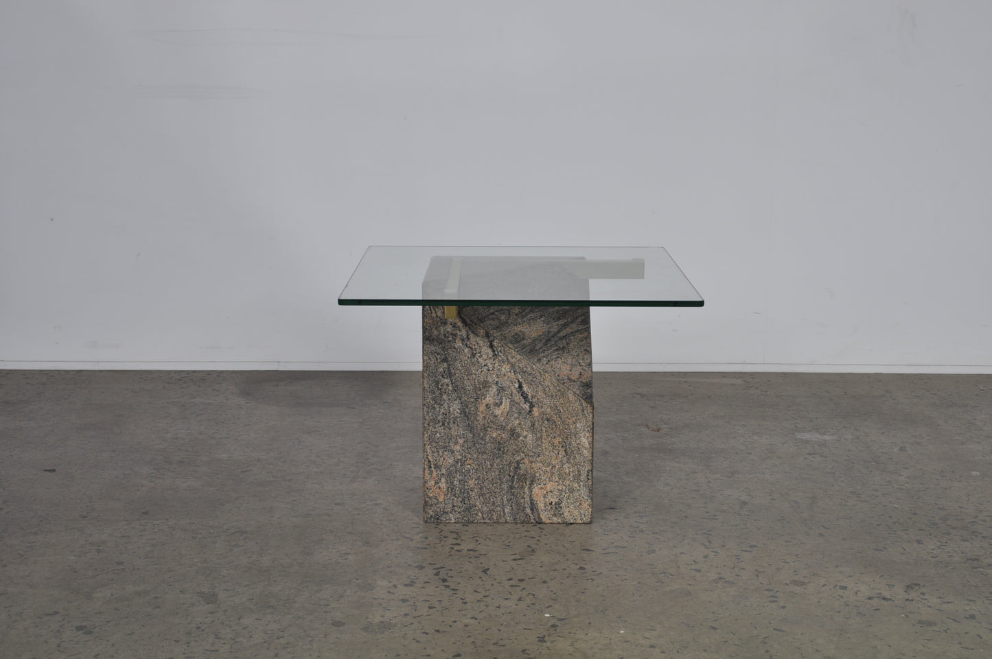 Glass coffee table with granite base.