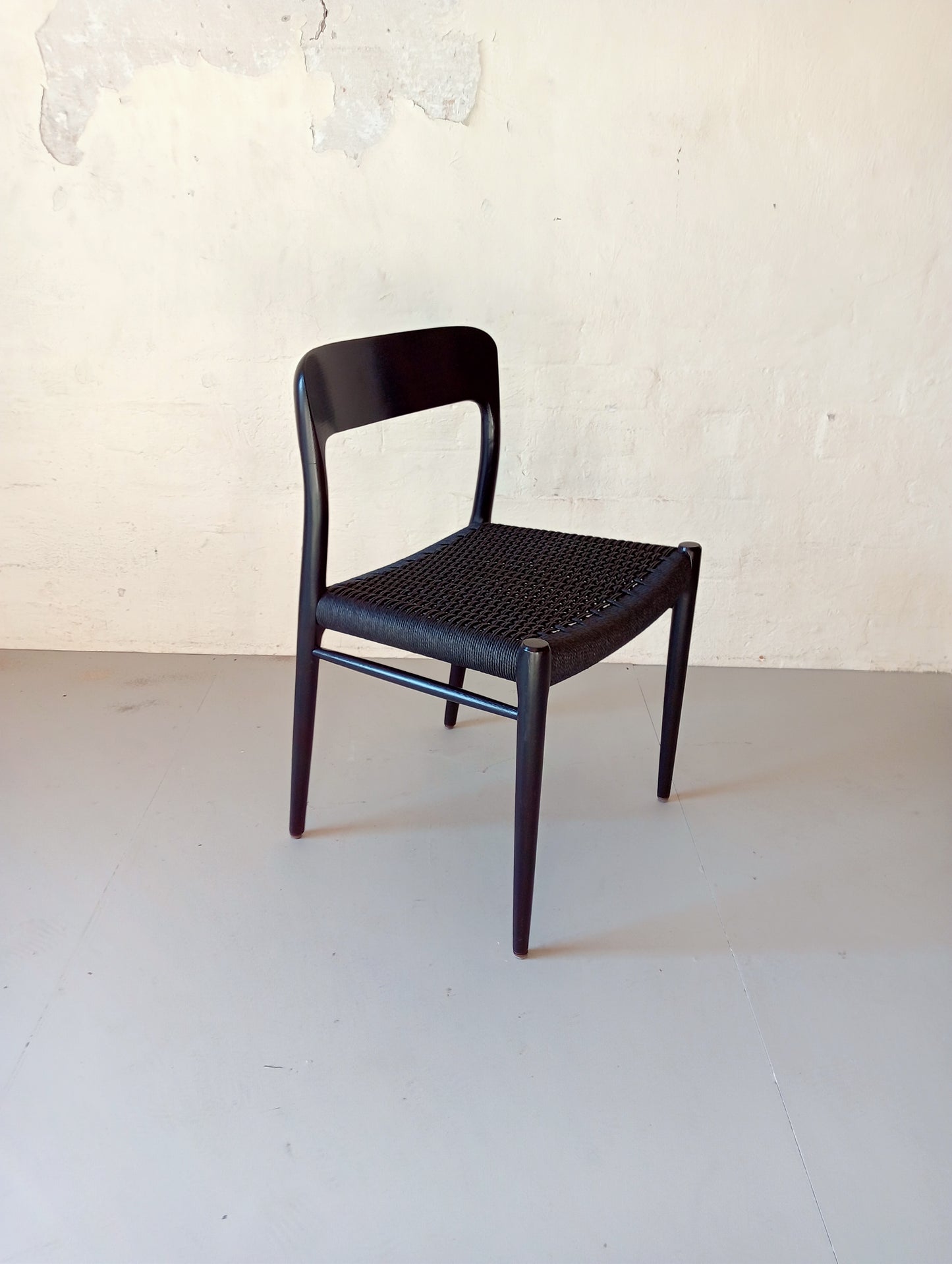 Niels O. Møller model 75 armchair. Set of four in black glazed wood.