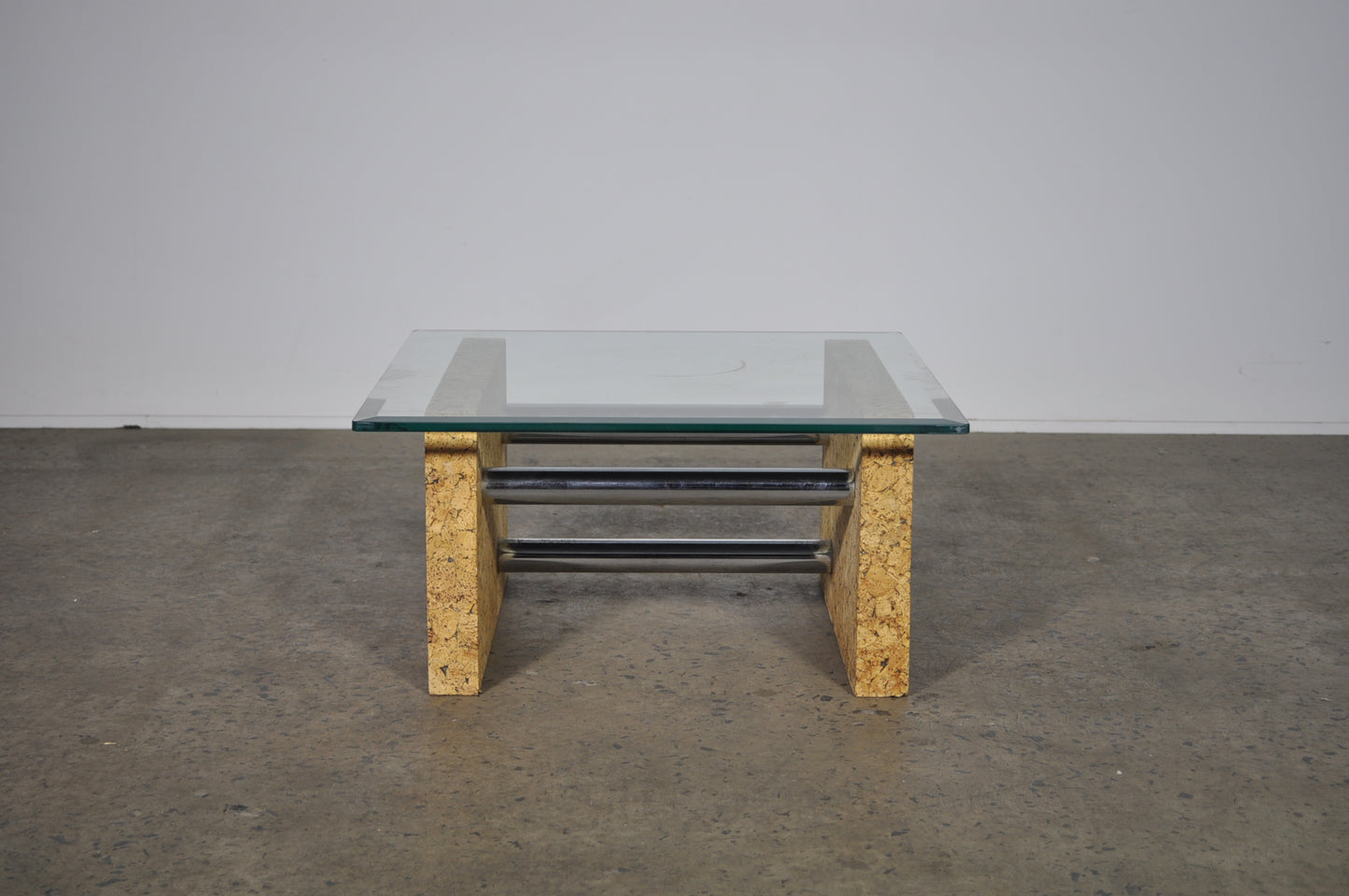 Brutalist glass coffee table with cork base.