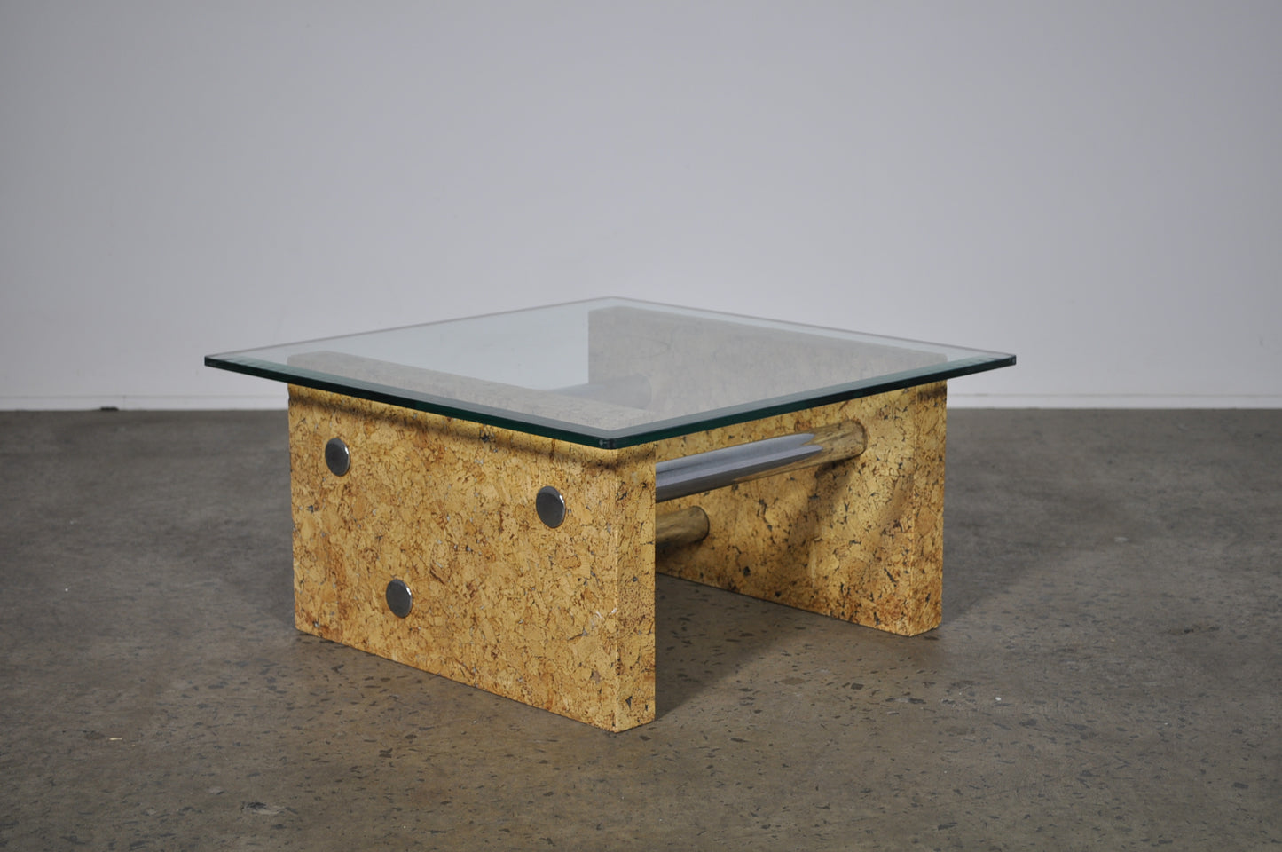 Brutalist glass coffee table with cork base.