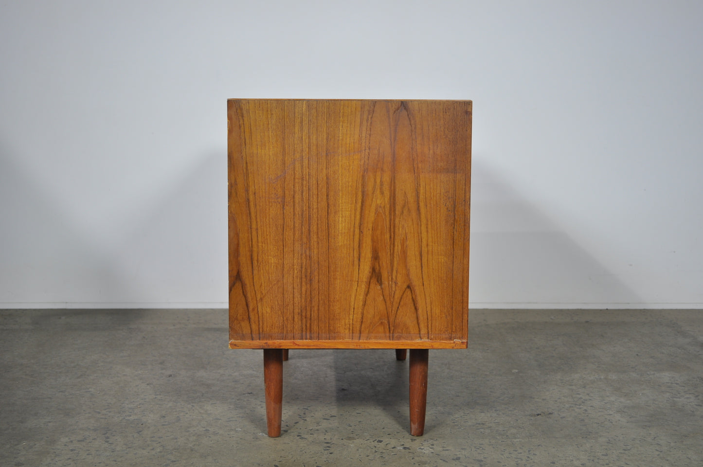 Teak storage unit with drawers.