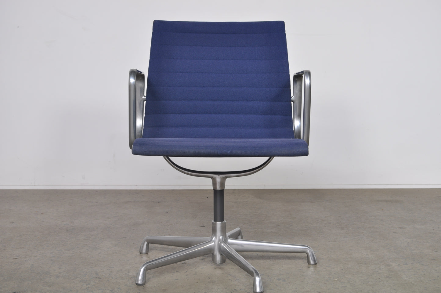 Eames Aluminium Group side chair with arms.