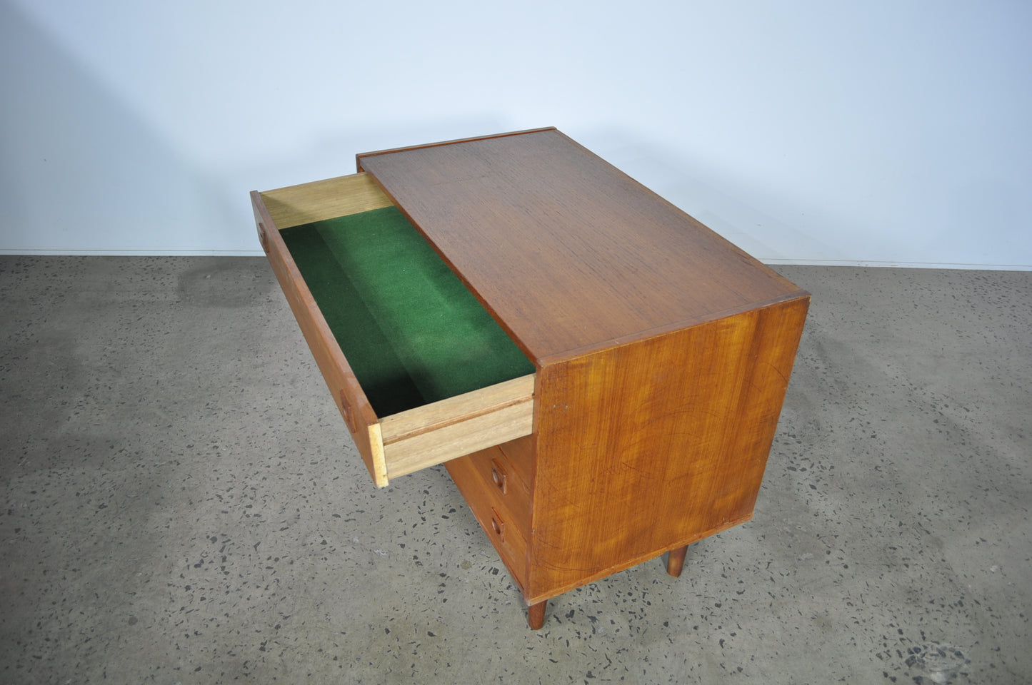 Teak storage unit with drawers.