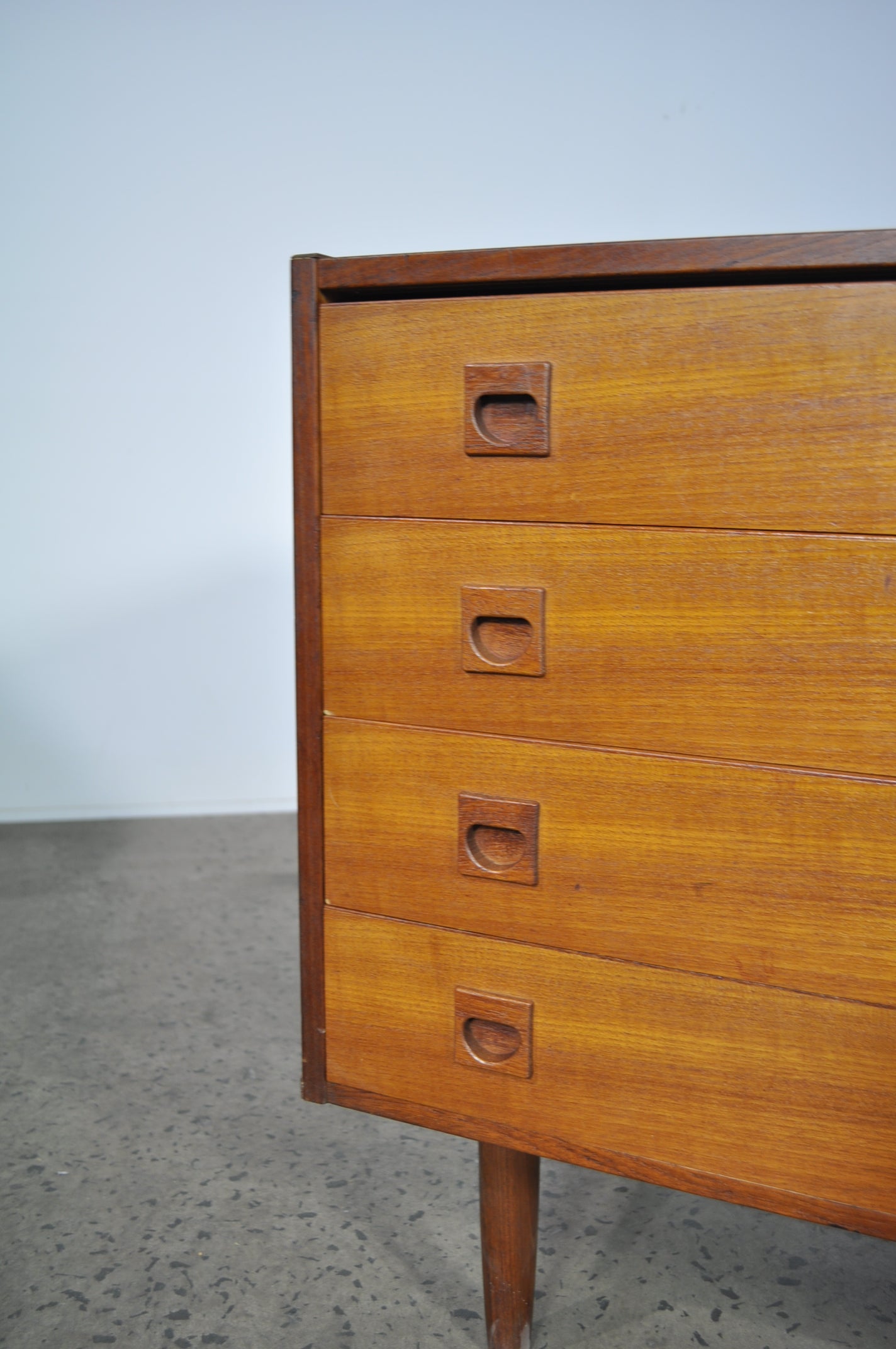 Teak storage unit with drawers.