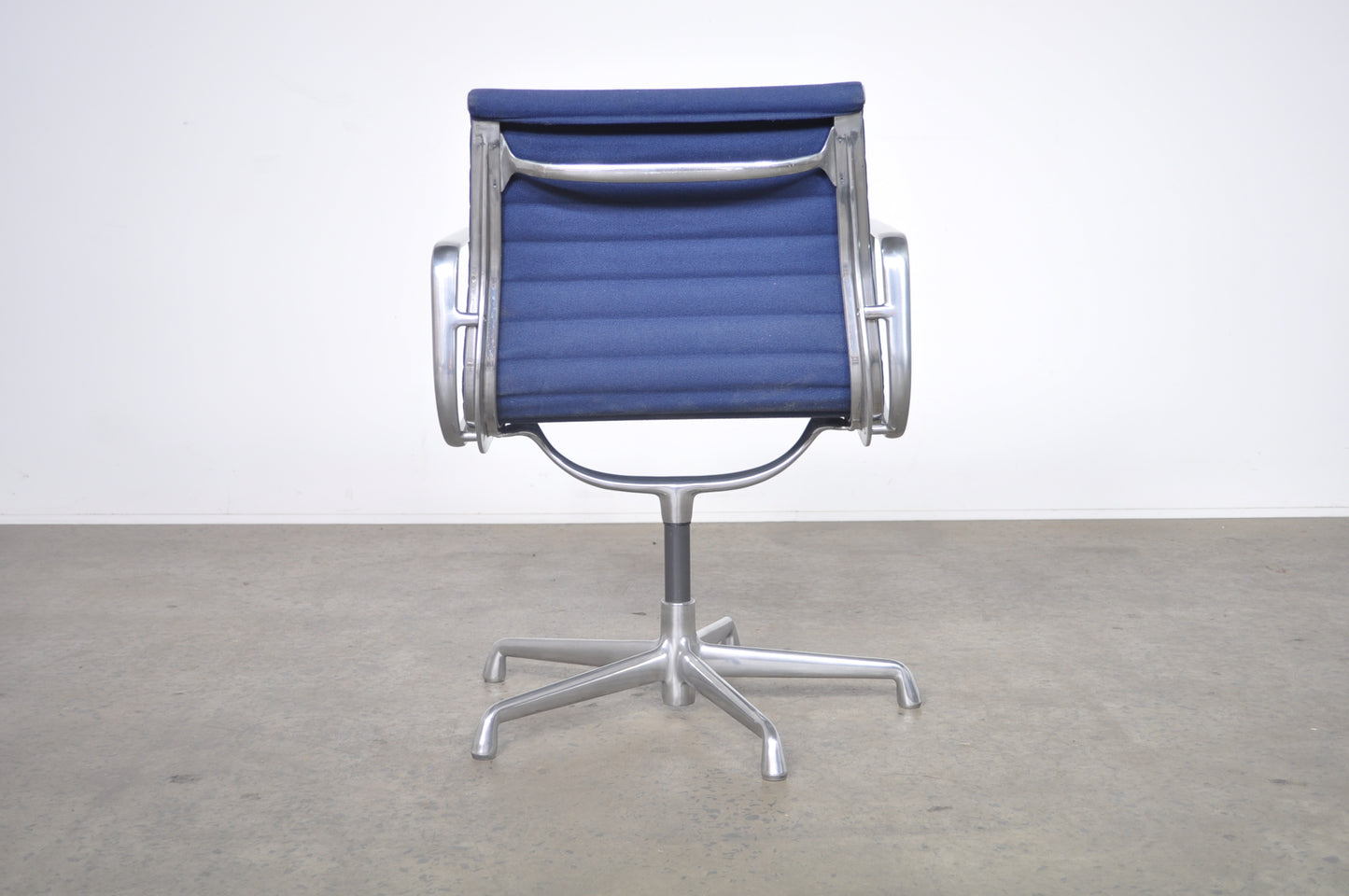 Eames Aluminium Group side chair with arms.