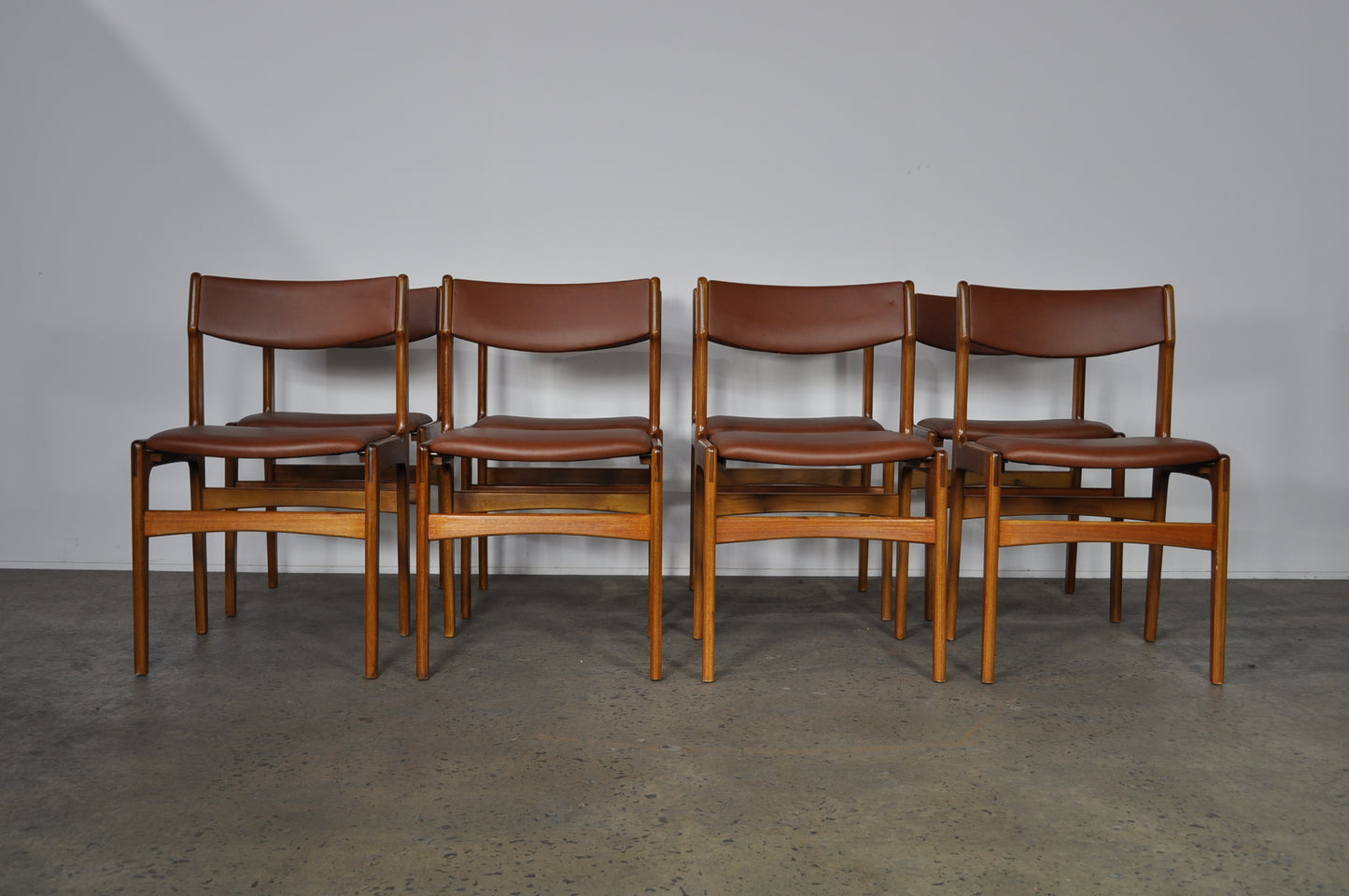 Erik Buch Teak dining chairs.Set of 8 In brown leather.