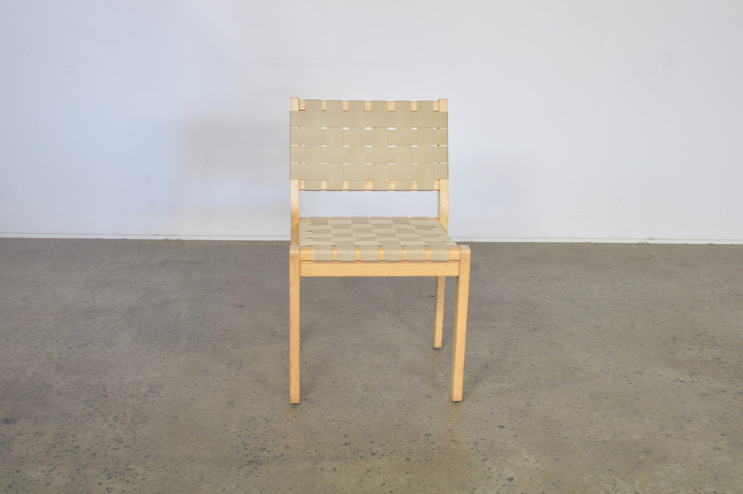 Alvar Aalto dining chairs by Artek in natural Danish webbing.