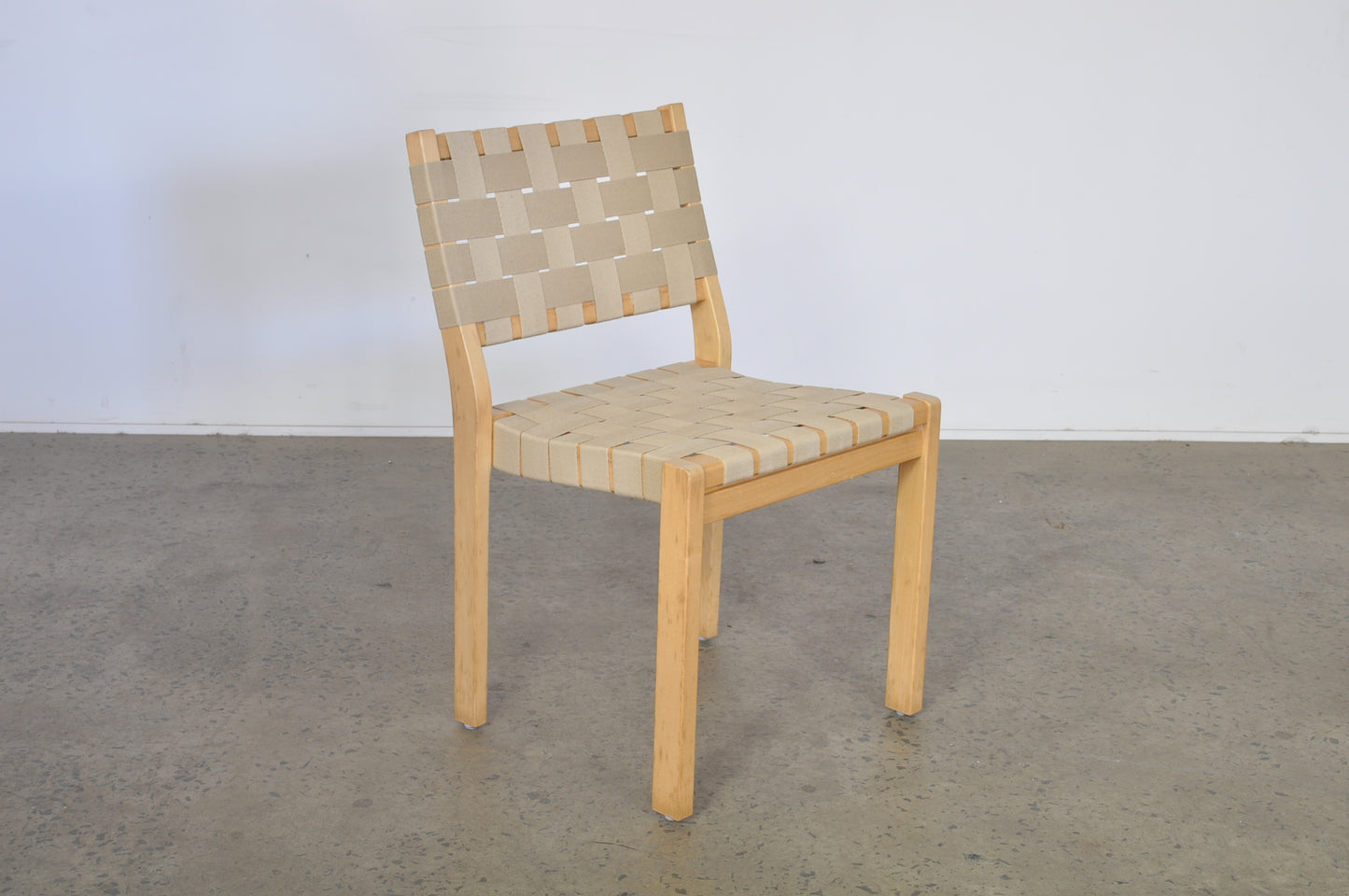 Alvar Aalto dining chairs by Artek in natural Danish webbing.
