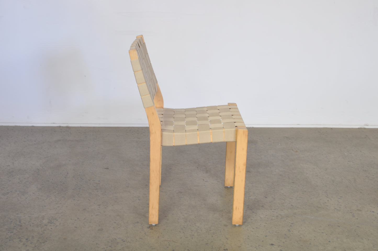 Alvar Aalto dining chairs by Artek in natural Danish webbing.