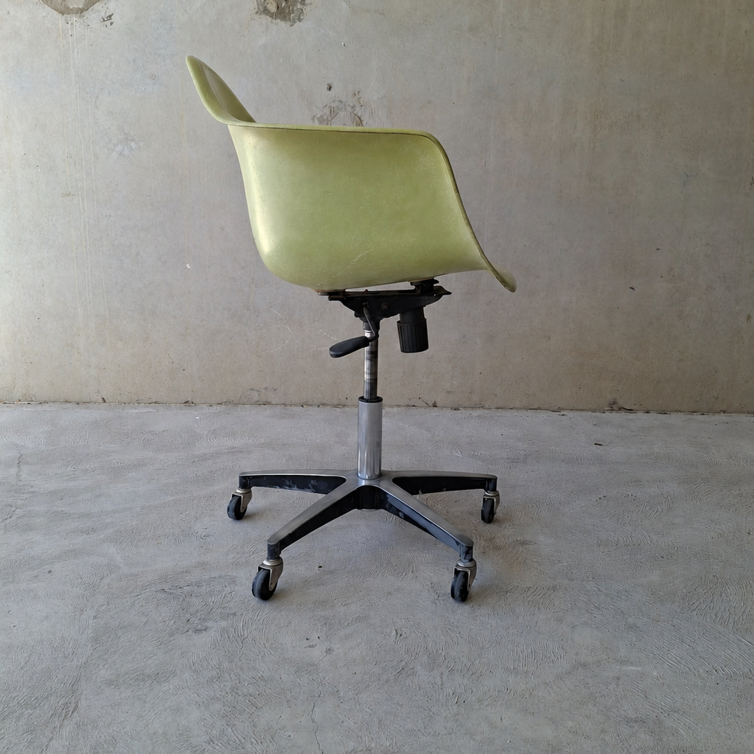 Modernica "Case Study" fibreglass shell rolling armchair.