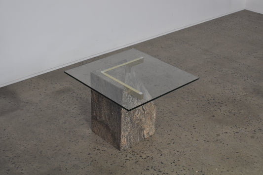 Glass coffee table with granite base.