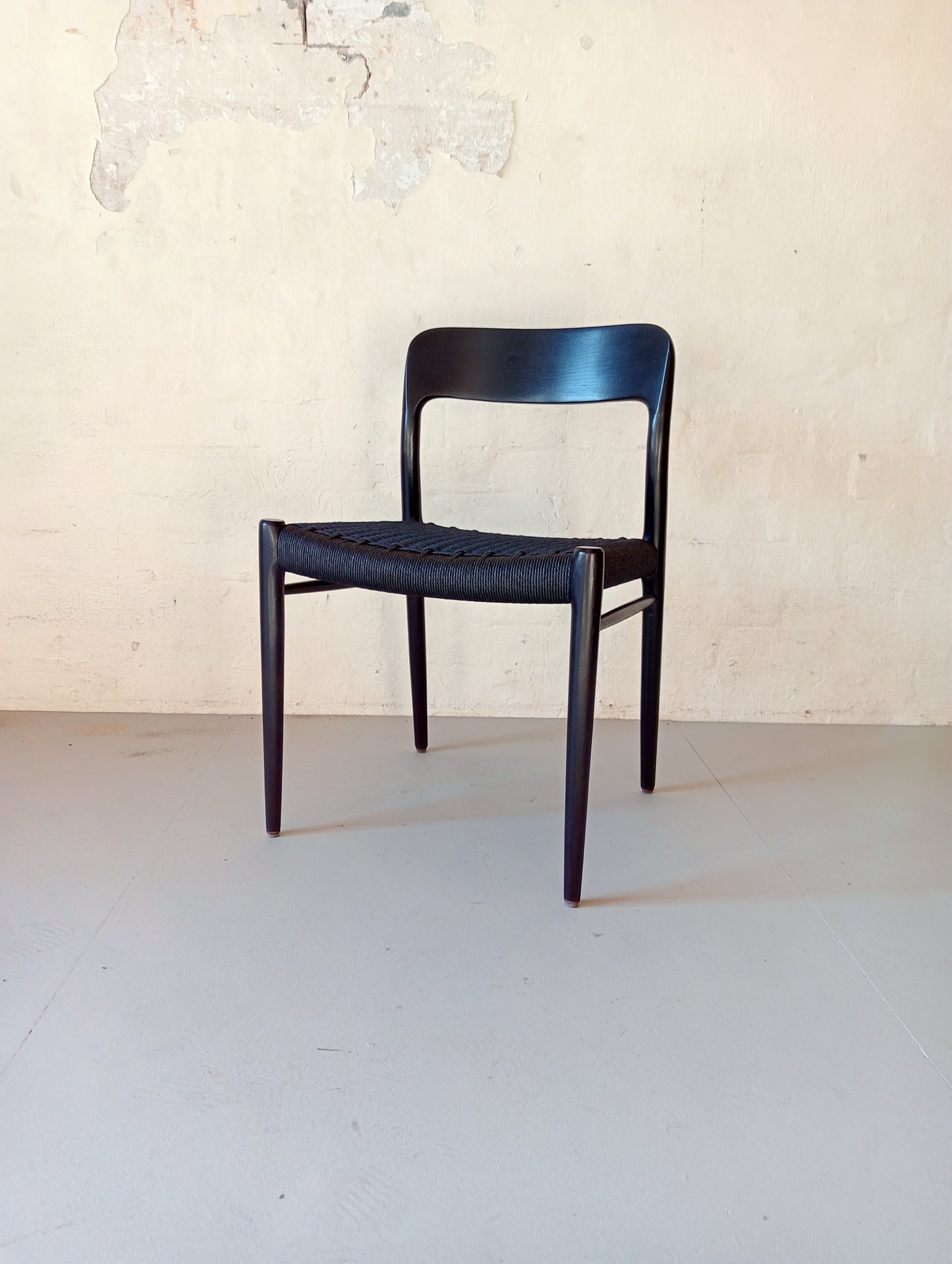 Niels O. Møller model 75 armchair. Set of four in black glazed wood.
