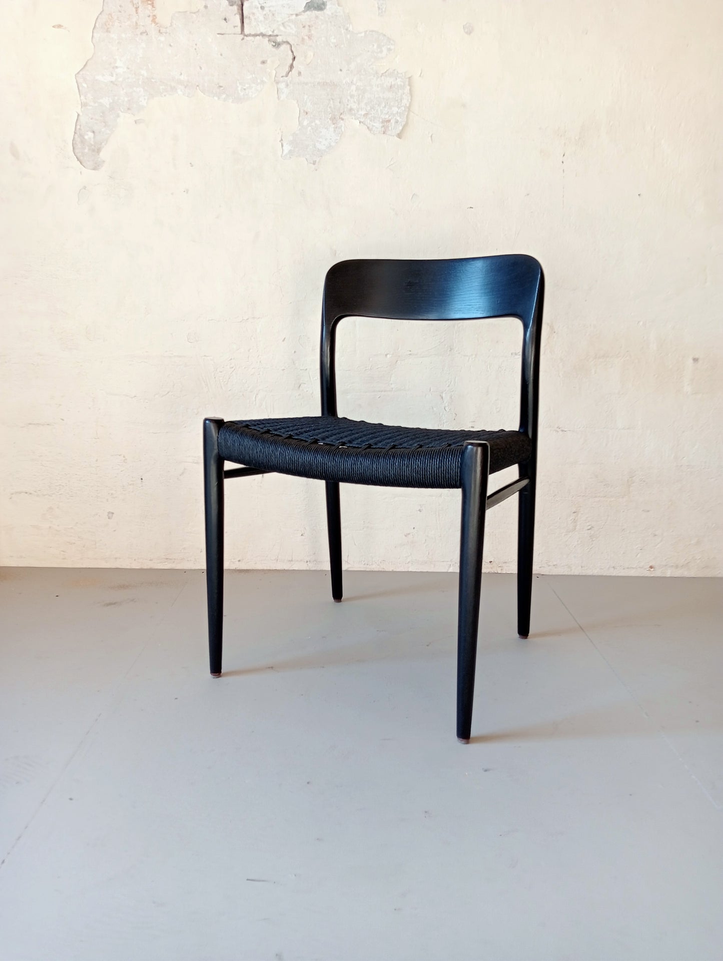 Niels O. Møller model 75 armchair. Set of four in black glazed wood.