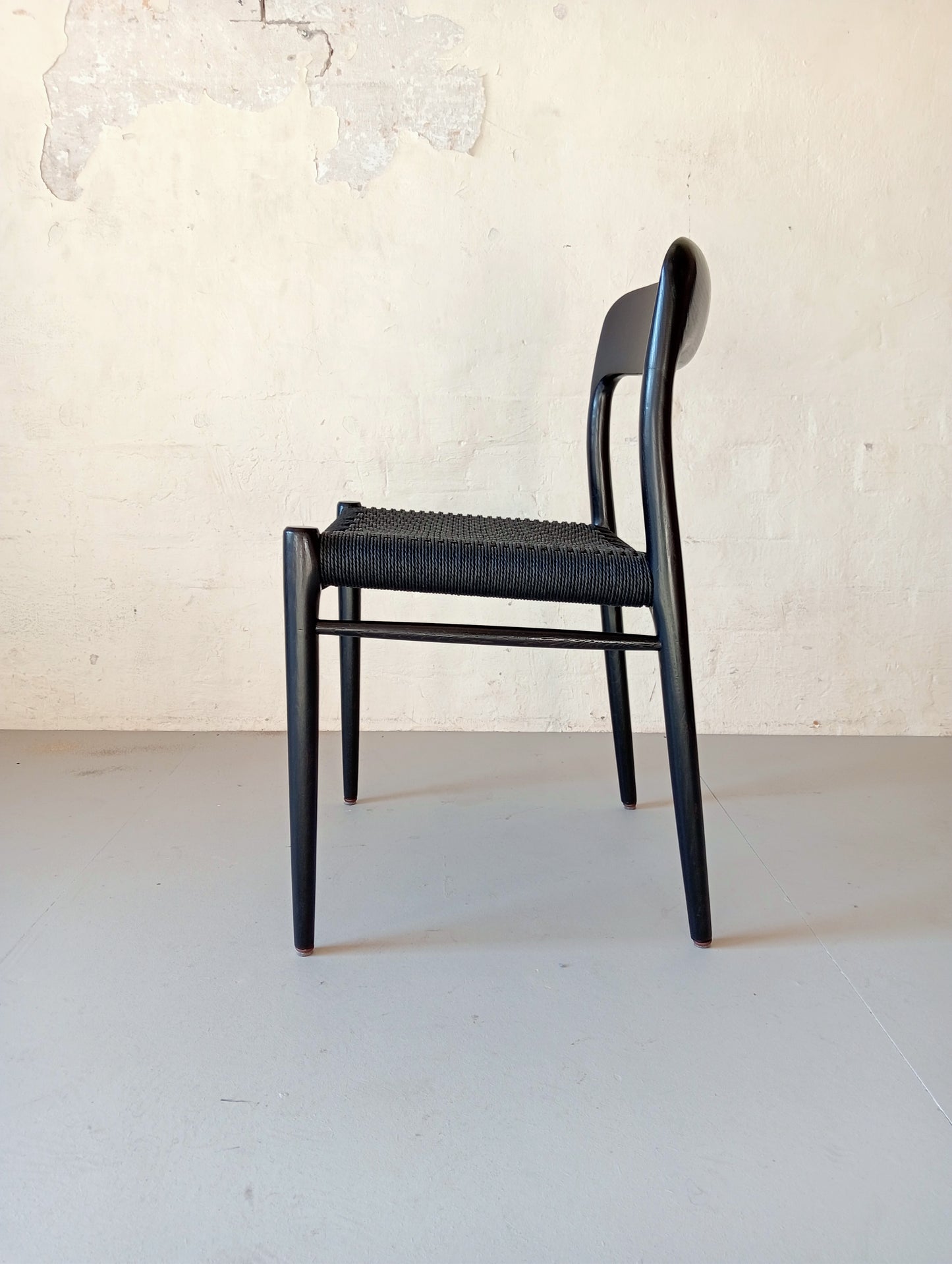 Niels O. Møller model 75 armchair. Set of four in black glazed wood.