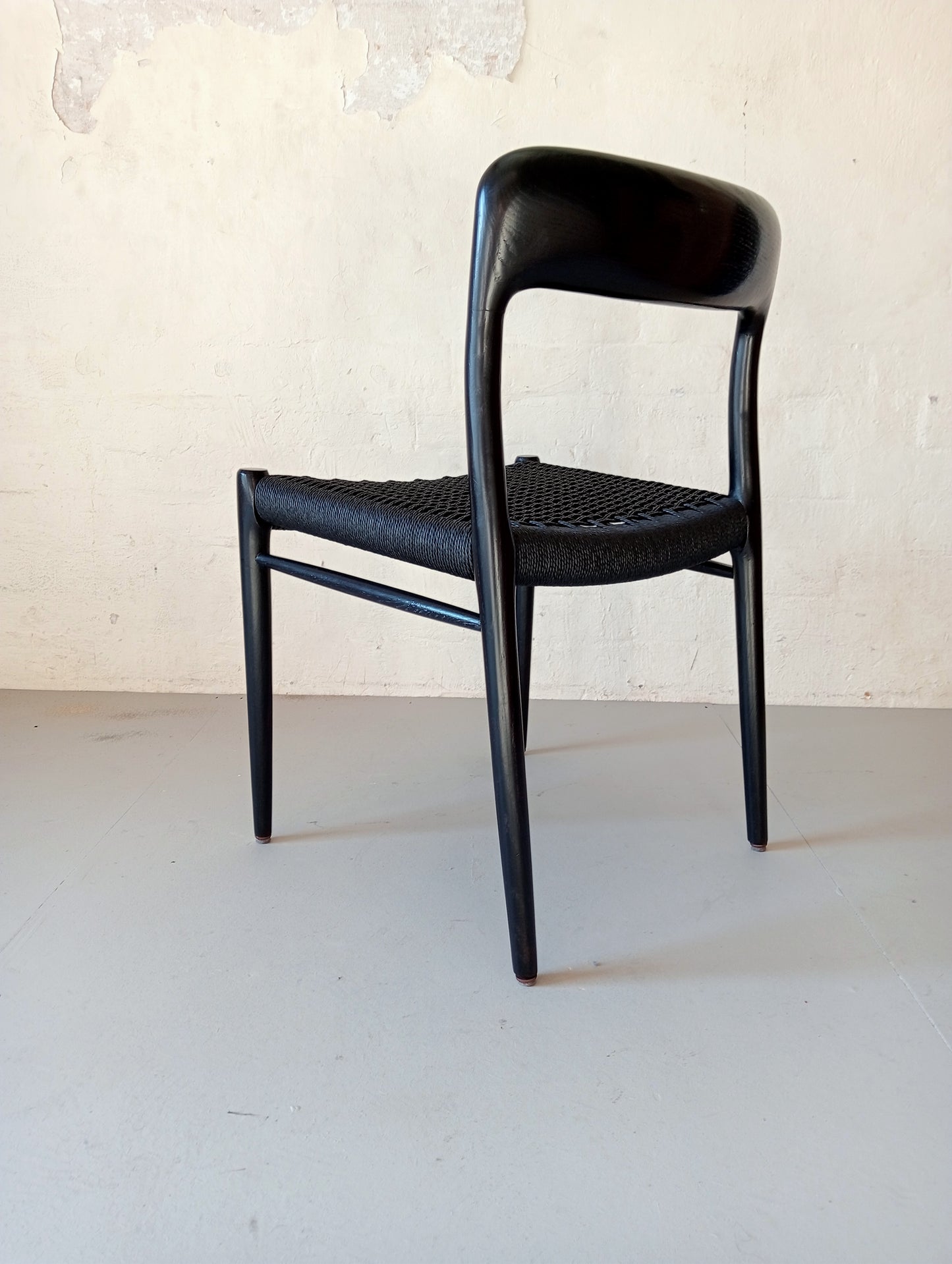 Niels O. Møller model 75 armchair. Set of four in black glazed wood.