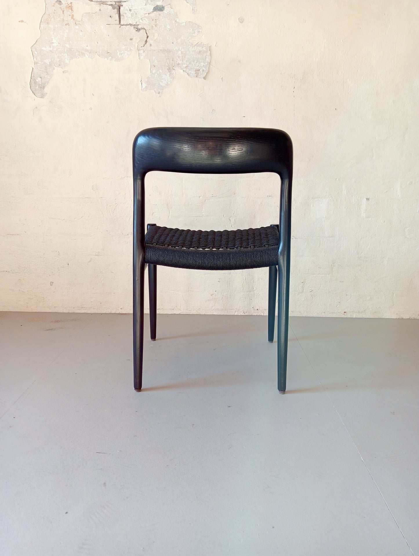Niels O. Møller model 75 armchair. Set of four in black glazed wood.
