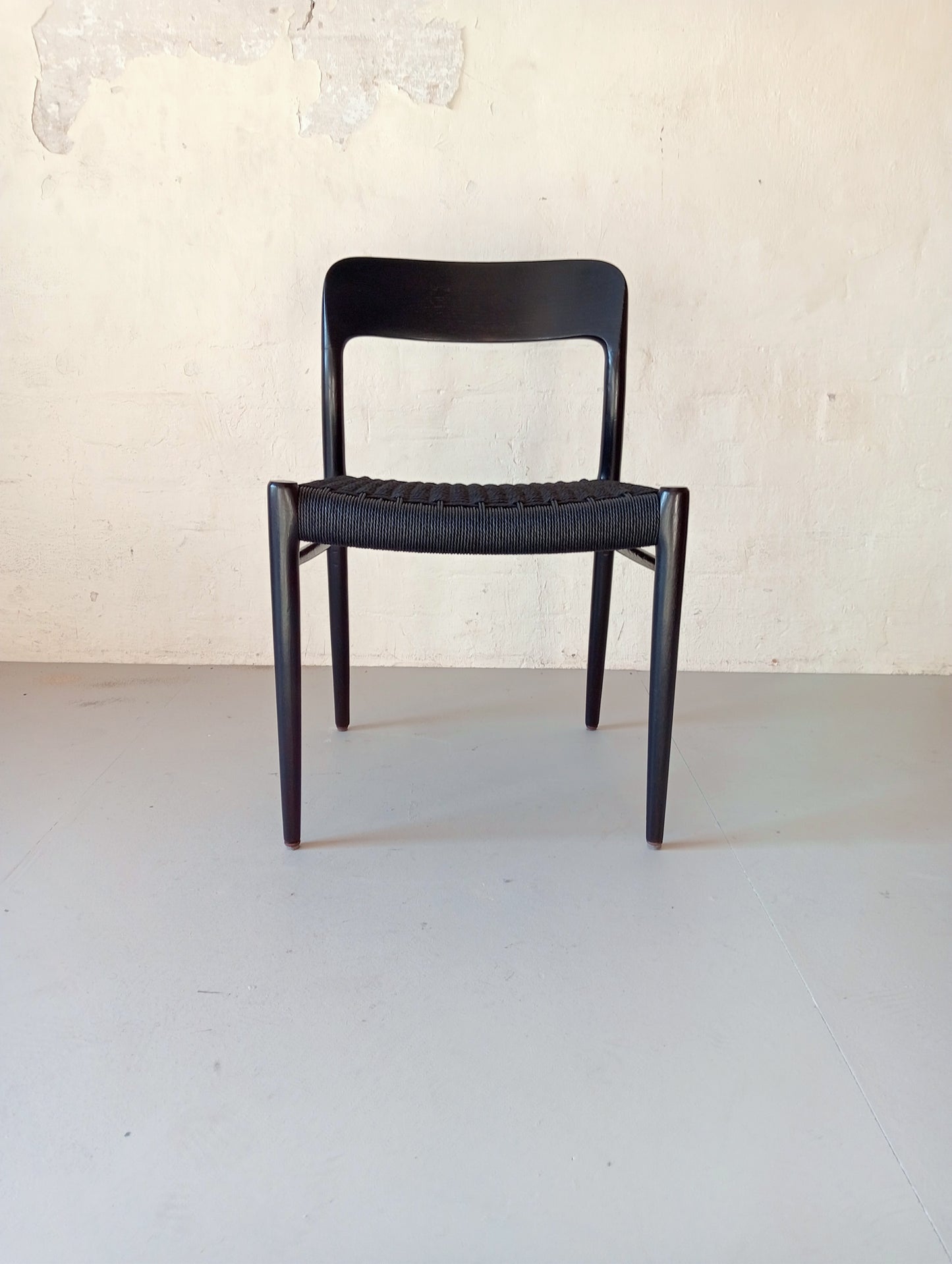 Niels O. Møller model 75 armchair. Set of four in black glazed wood.