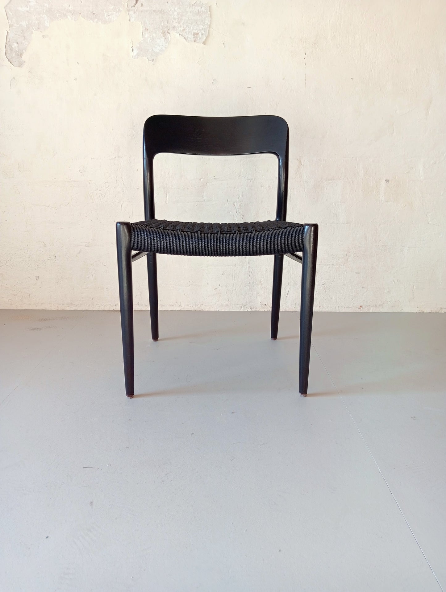 Niels O. Møller model 75 armchair. Set of four in black glazed wood.