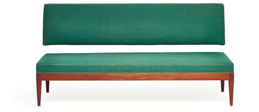 Frits Henningsen. Mahogany sofa/daybed with wall-mounted backrest.