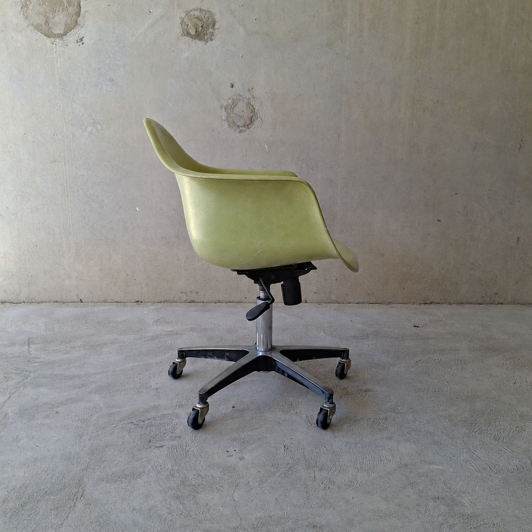 Modernica "Case Study" fibreglass shell rolling armchair.