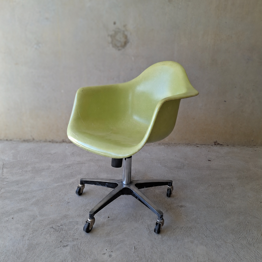 Modernica "Case Study" fibreglass shell rolling armchair.