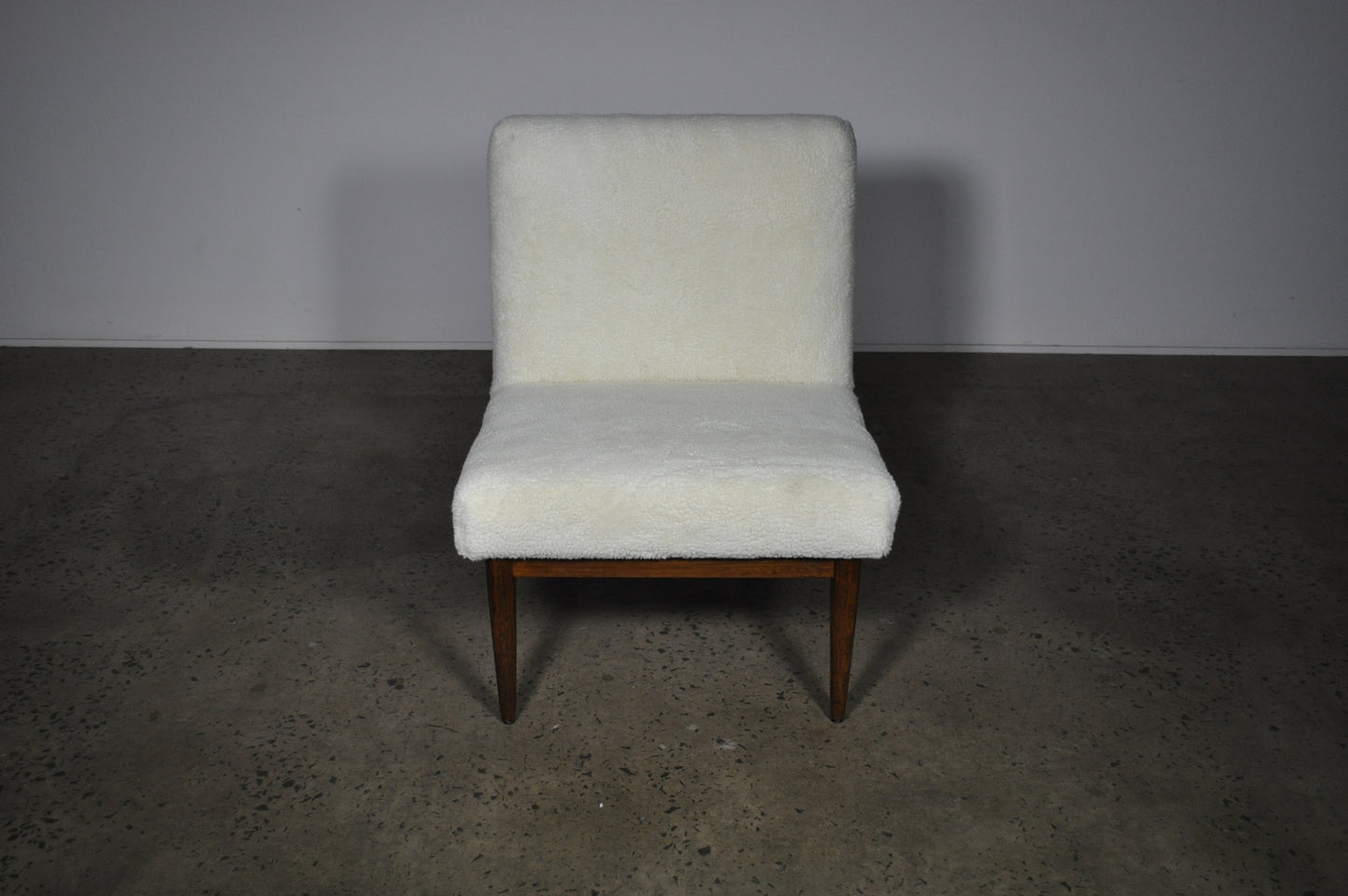 Blackwood lounge chair with sheepskin.