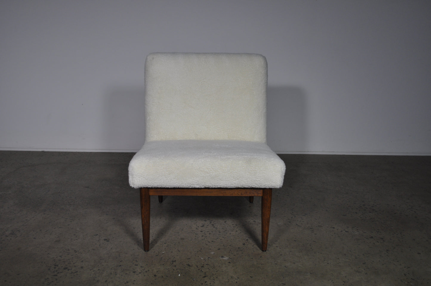 Blackwood lounge chair with sheepskin.