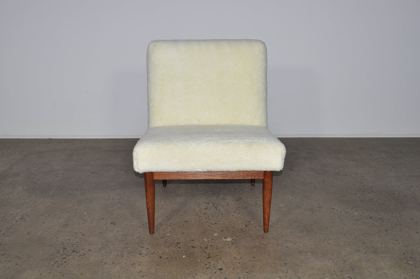 Blackwood lounge chair with sheepskin.