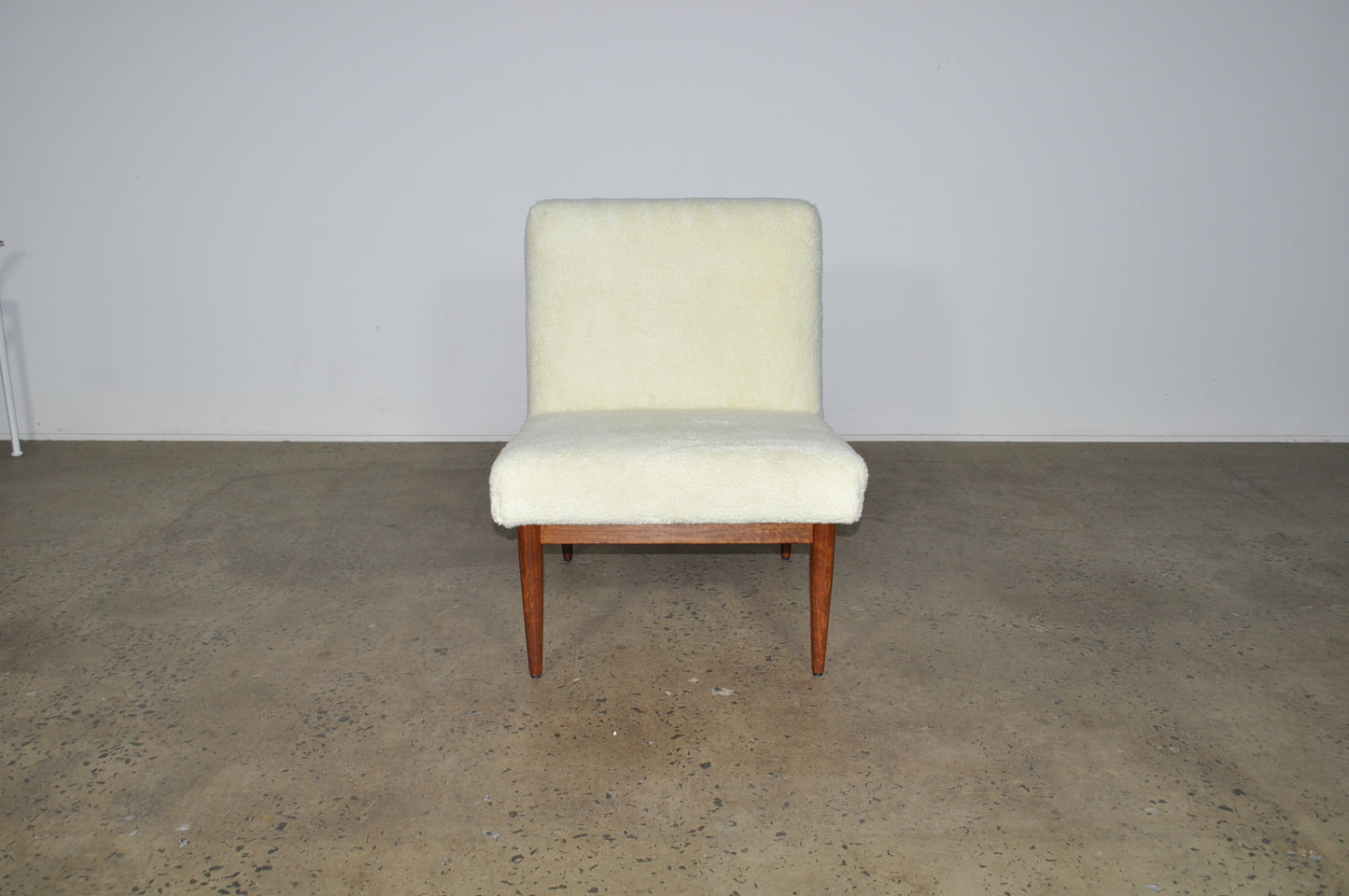 Blackwood lounge chair with sheepskin.
