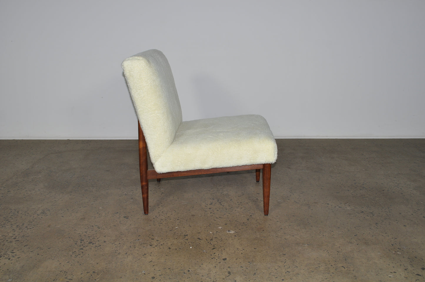 Blackwood lounge chair with sheepskin.