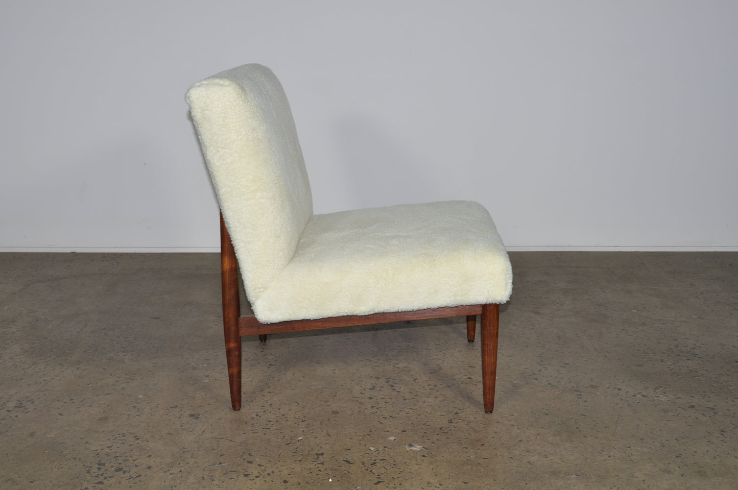 Blackwood lounge chair with sheepskin.