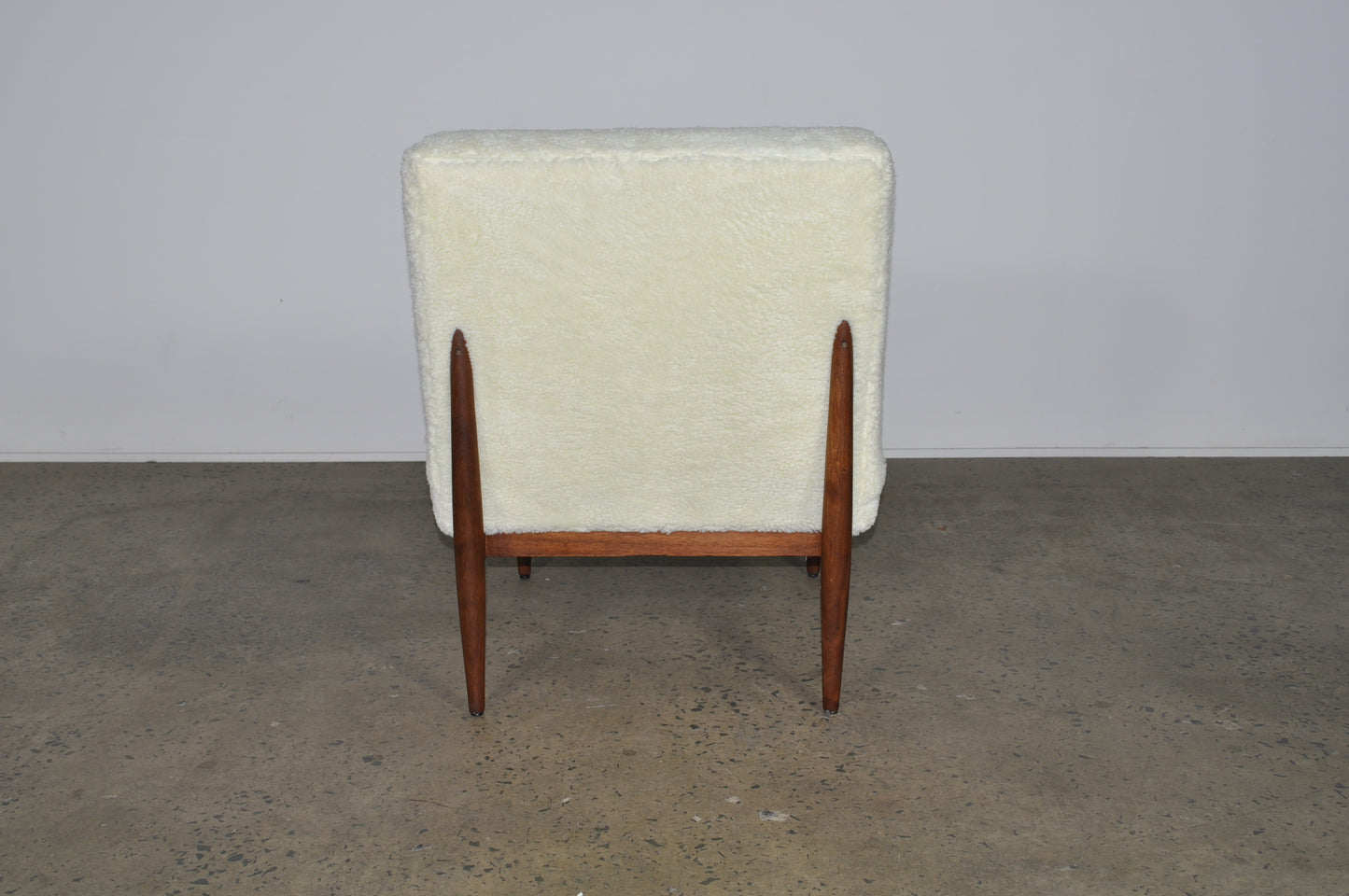 Blackwood lounge chair with sheepskin.