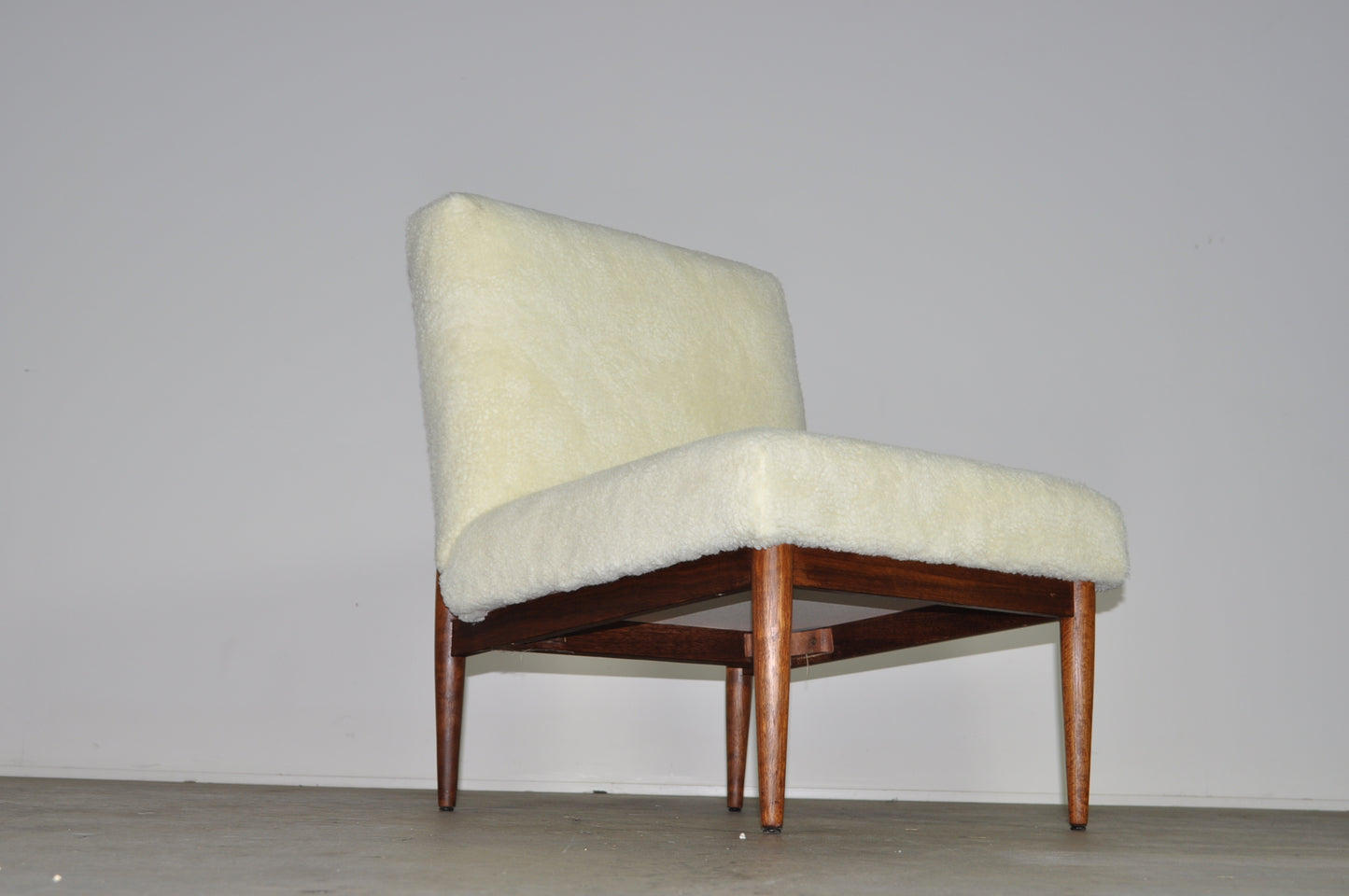 Blackwood lounge chair with sheepskin.