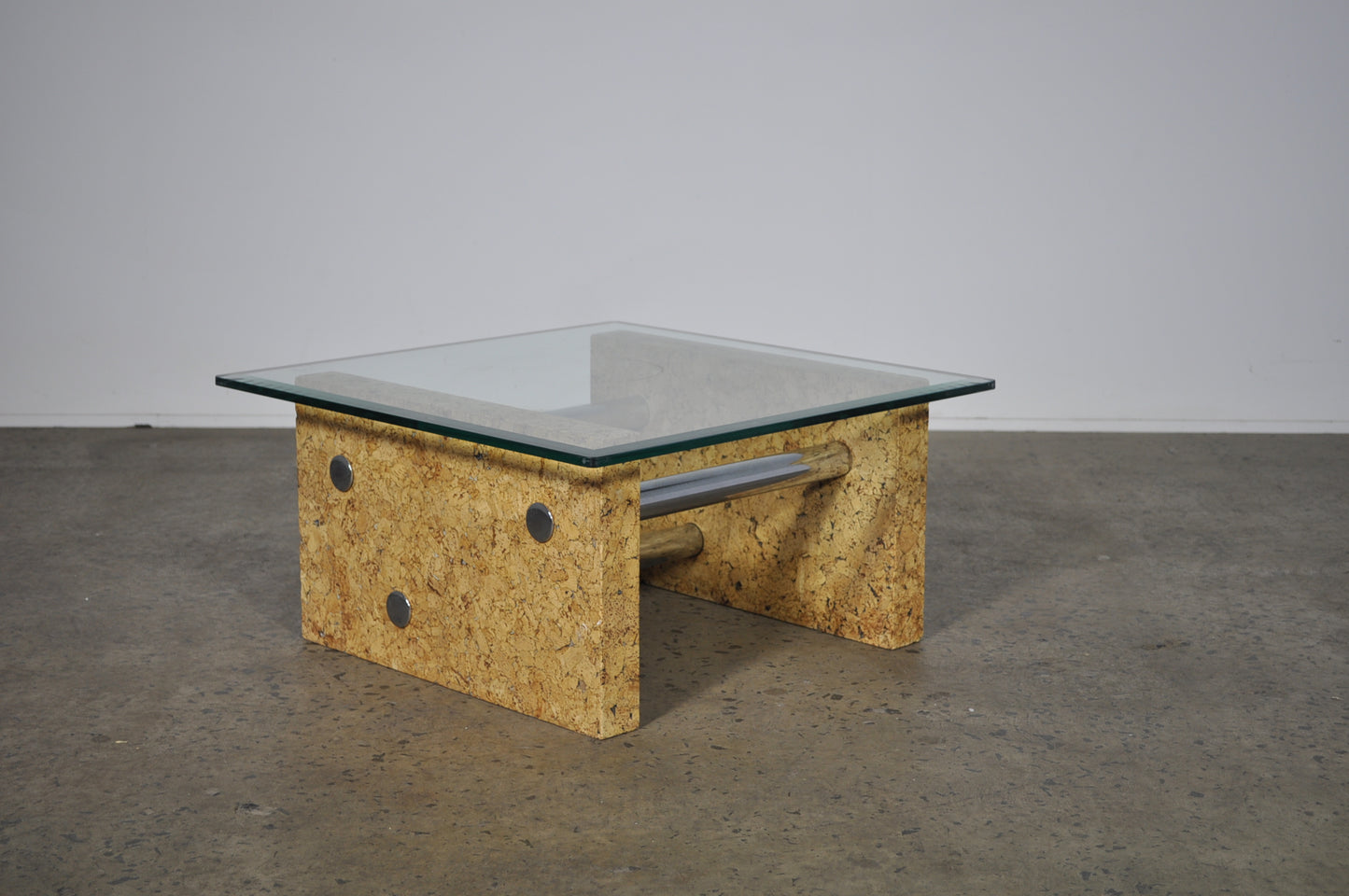 Brutalist glass coffee table with cork base.