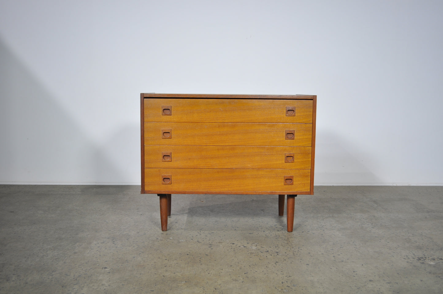 Teak storage unit with drawers.