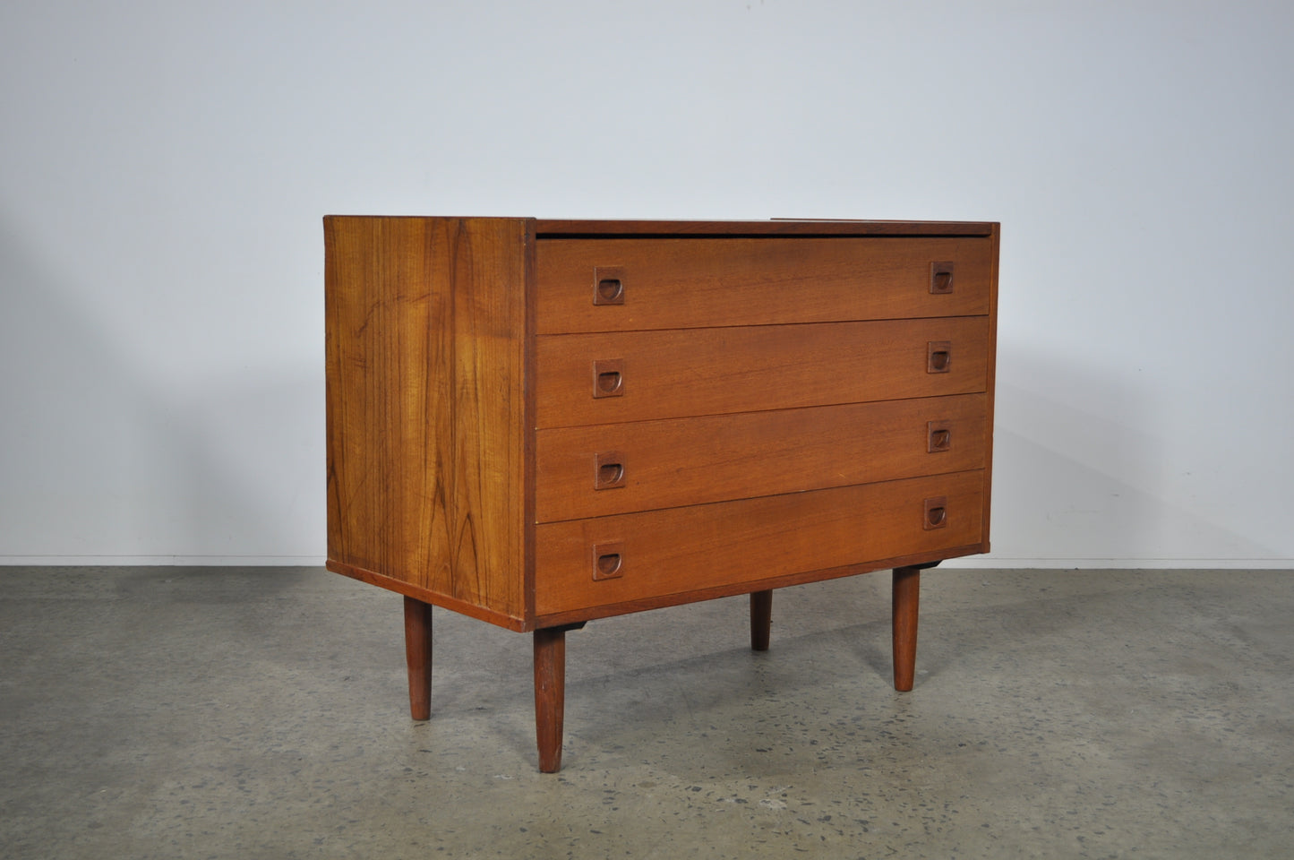 Teak storage unit with drawers.