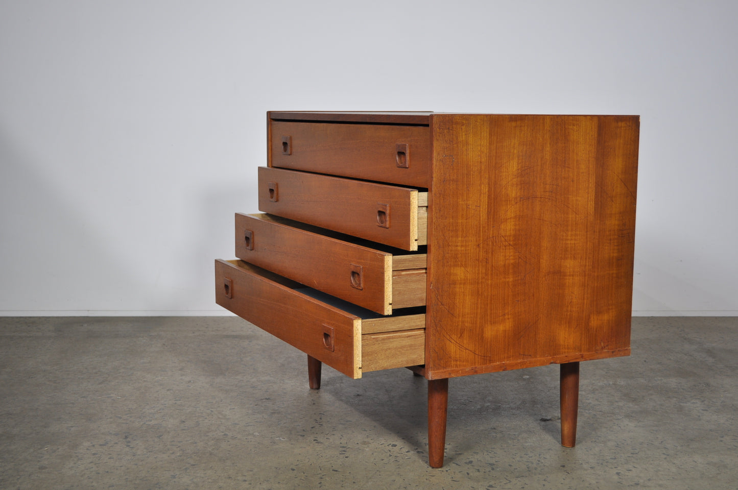 Teak storage unit with drawers.