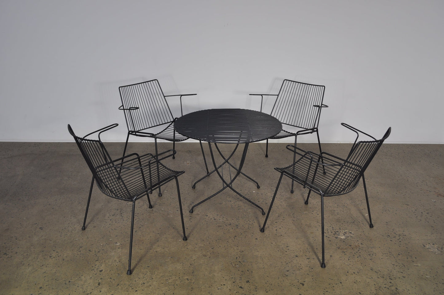 A pair of Breotex chairs and table .